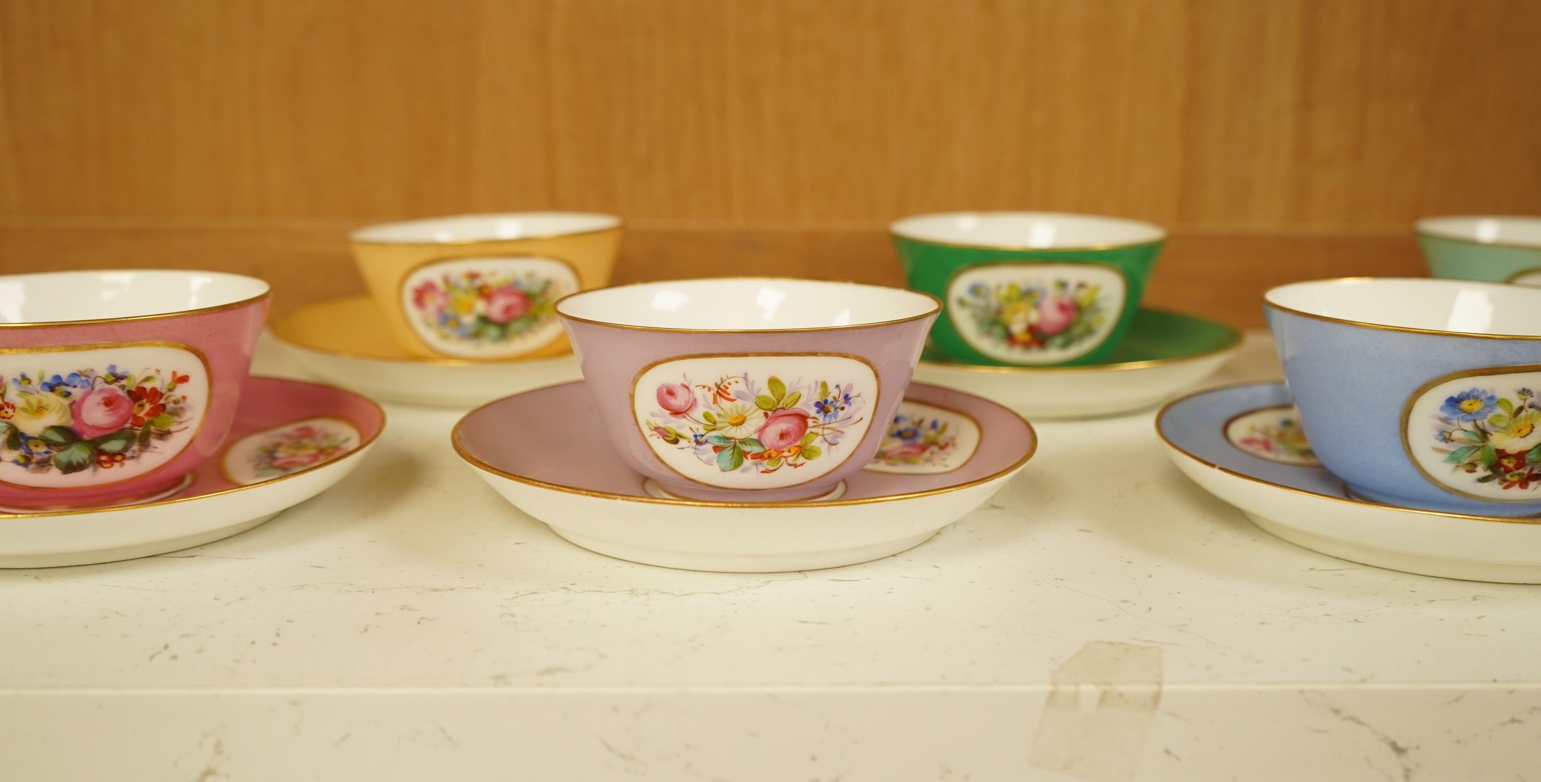 A Sevres style harlequin tea service for six, each saucer 13cm in diameter